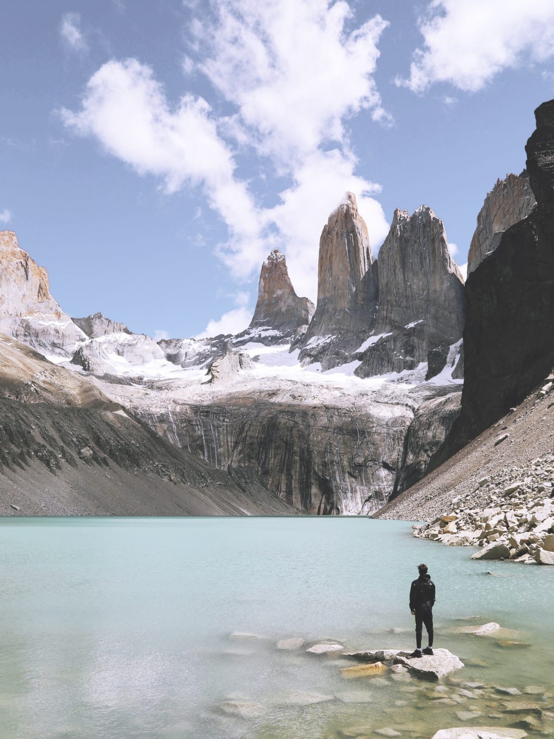 Hiker at Mirador Base Las Torres in Patagonia mountains