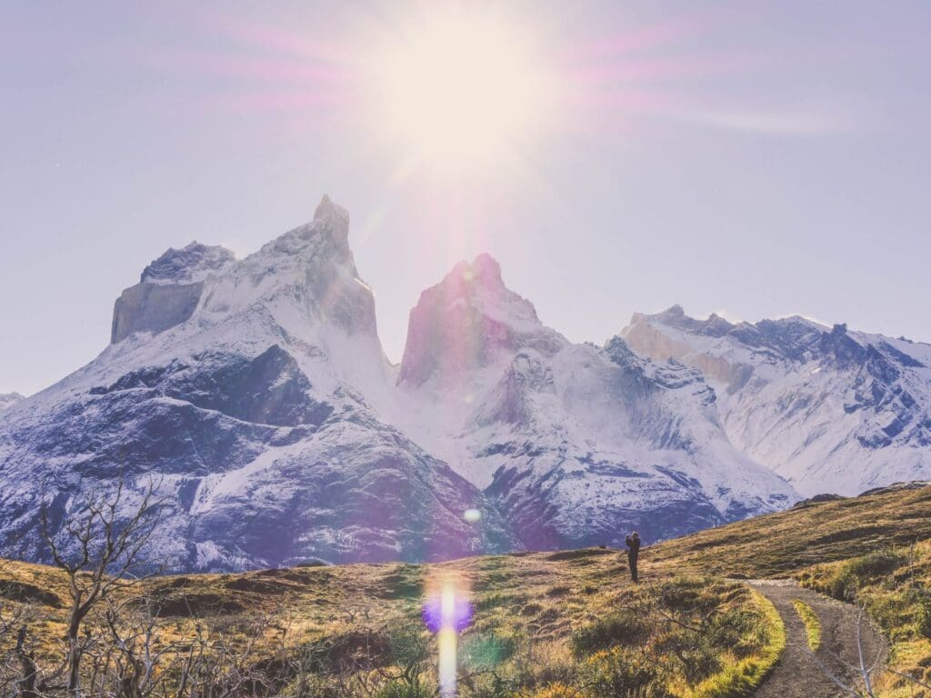 Hiker on W Trek trail in front of Los Cuernos, Torres del Paine