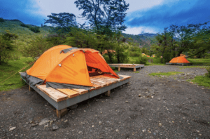 An exterior photograph of a campsite with tents in Torres del Paine Park