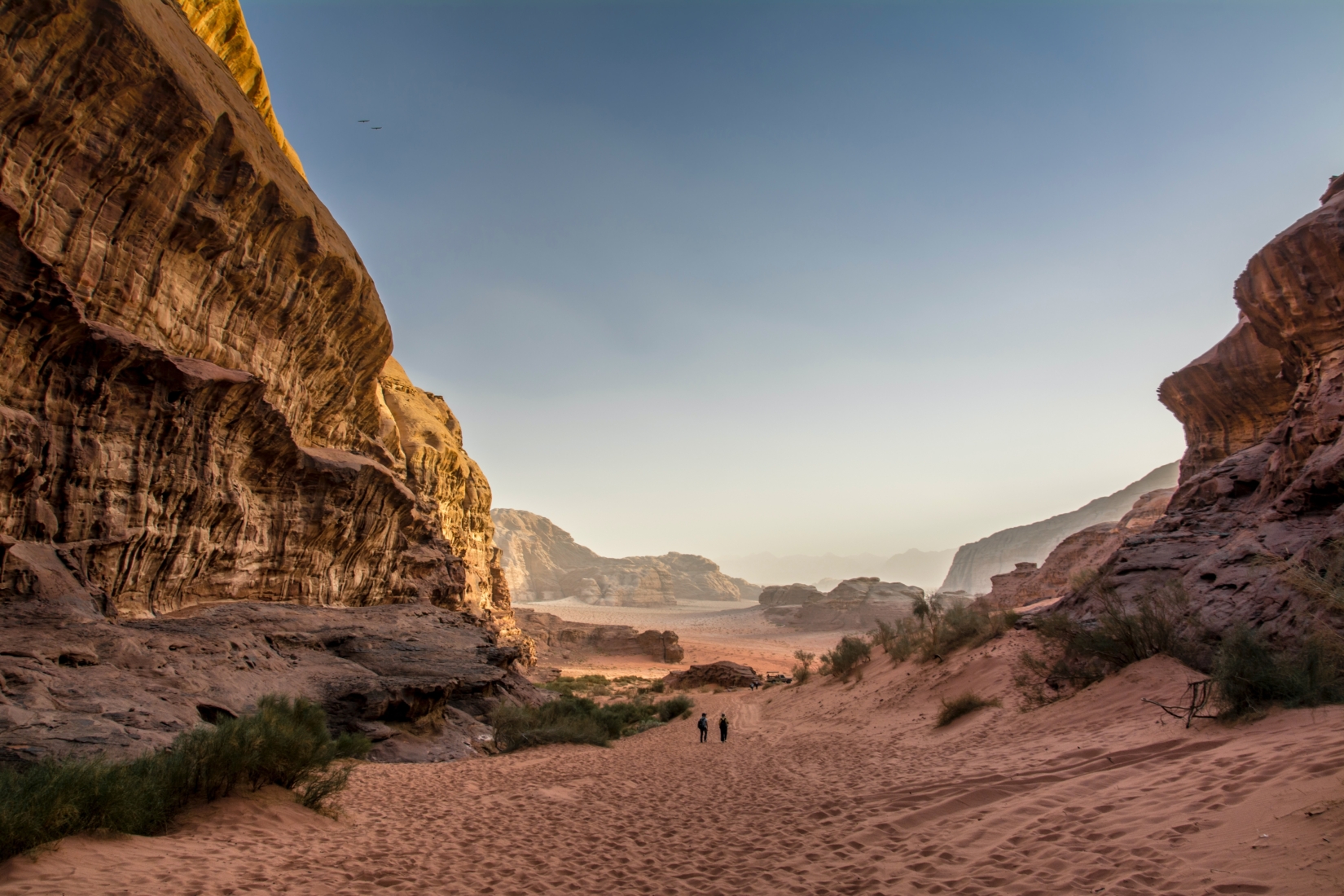 Sand dunes and rocky desert mountains in the Wadi Rum Desert