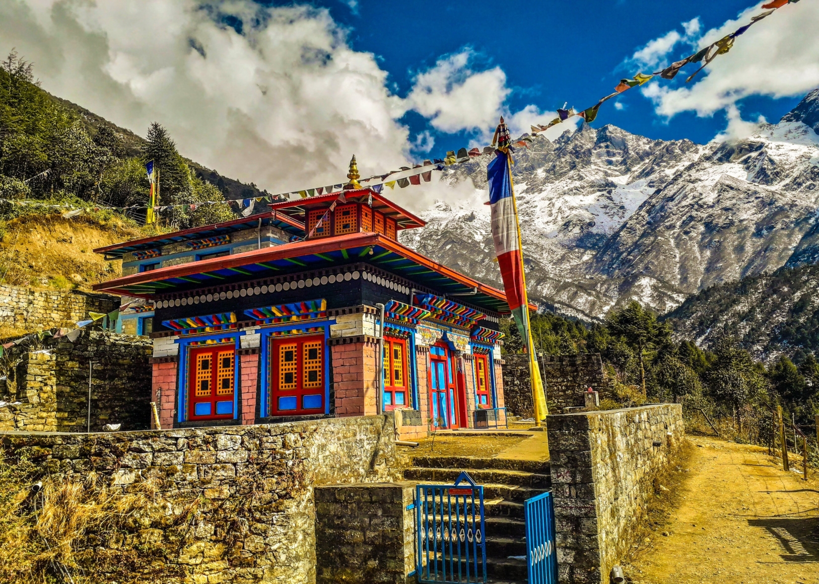 Colorful building in Nepal with mountains in background