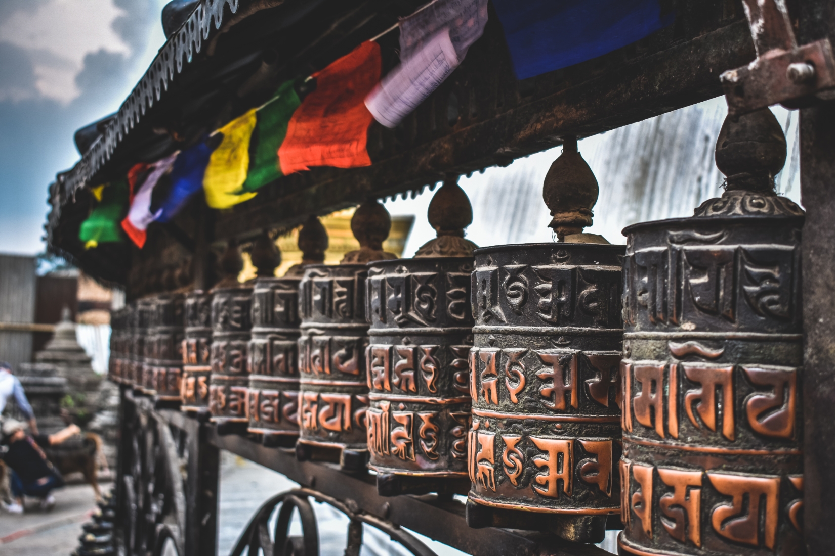 Buddhist prayer wheels are pictured in a row in Nepal
